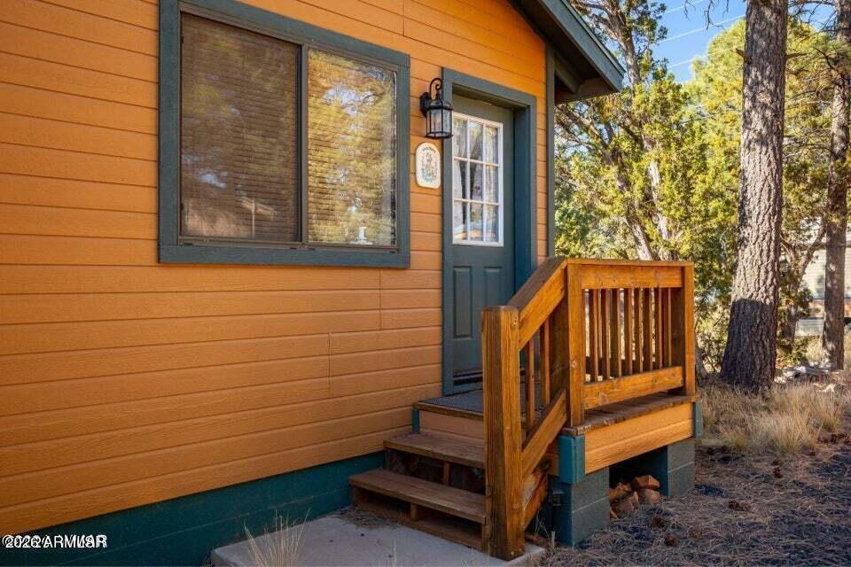 2086 Pinewood Drive Overgaard, AZ 85933 - Photo 7 of 33 a view of a house with a small wooden fence
