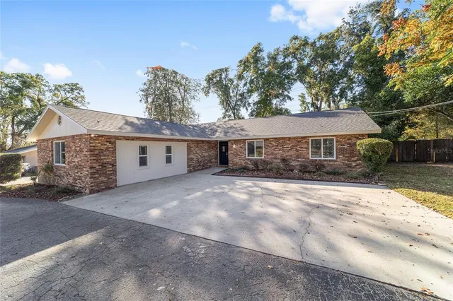 a kitchen with white cabinets and appliances