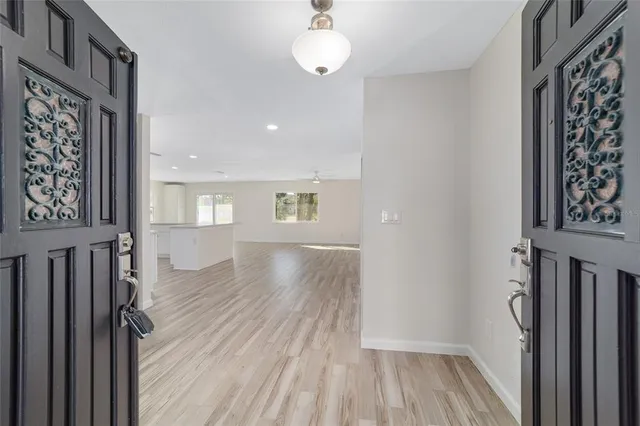 a kitchen with stainless steel appliances granite countertop a refrigerator and a stove top oven