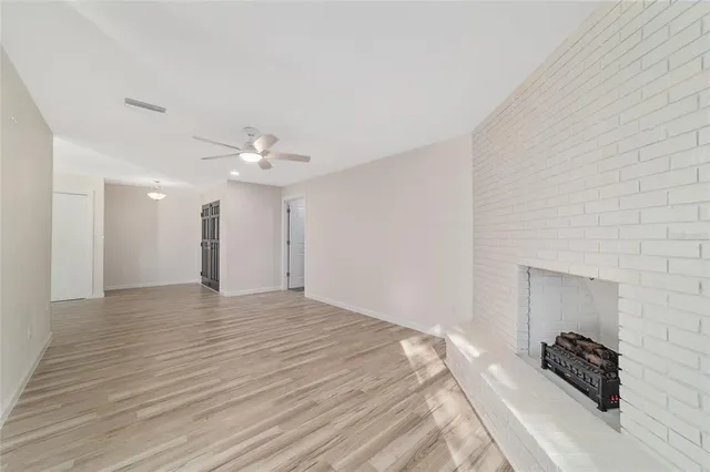 a bathroom with a toilet a sink a vanity and mirror