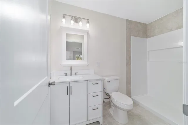 a view of a room with wooden walls