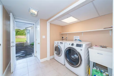 a view of storage and utility room with washer and dryer