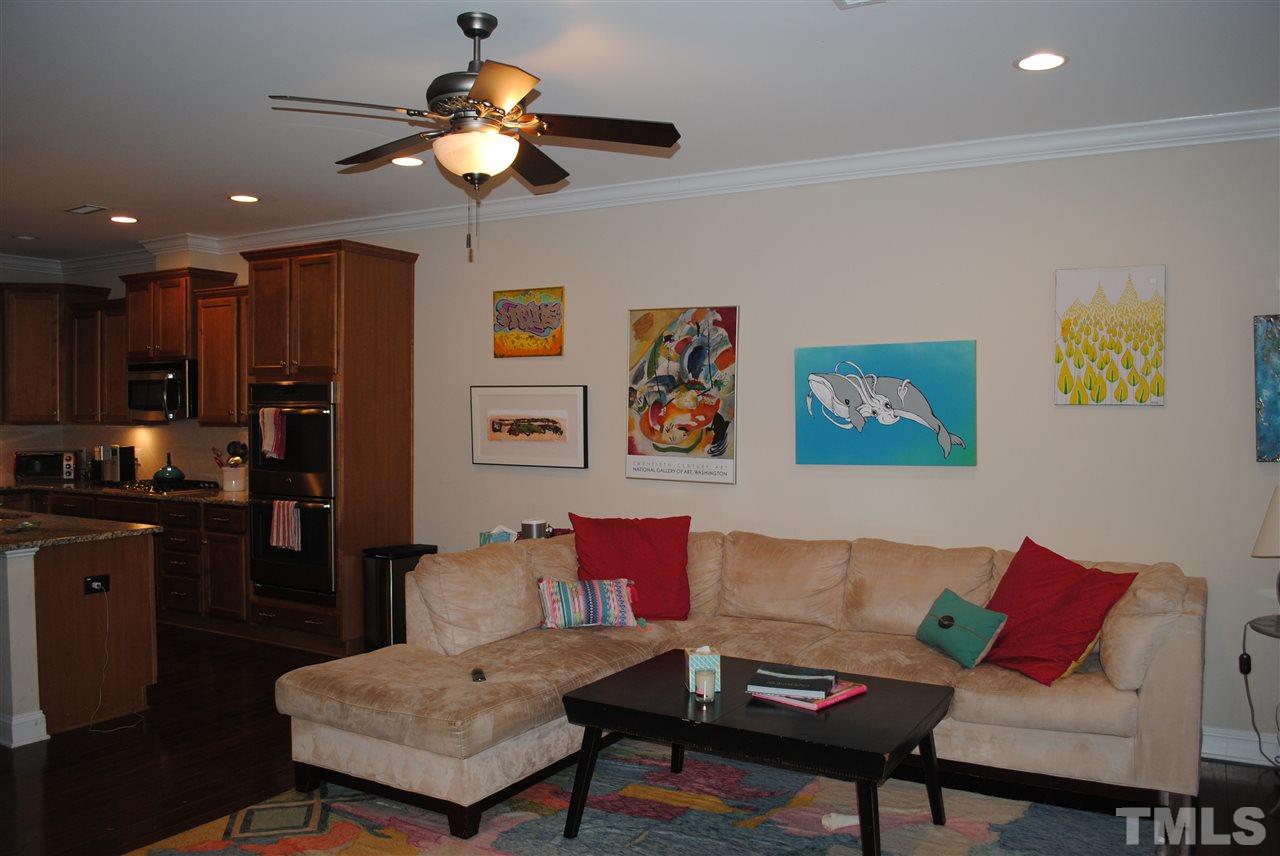 2352 Noble Road Raleigh, NC 27608 - Photo 2 of 24 a living room with furniture and a chandelier