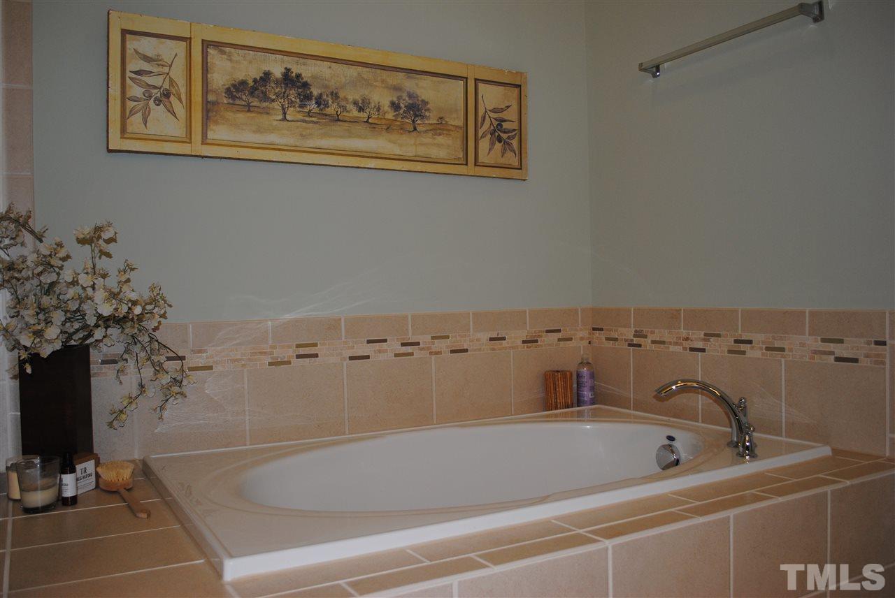 2352 Noble Road Raleigh, NC 27608 - Photo 15 of 24 a bathroom with a bathtub
