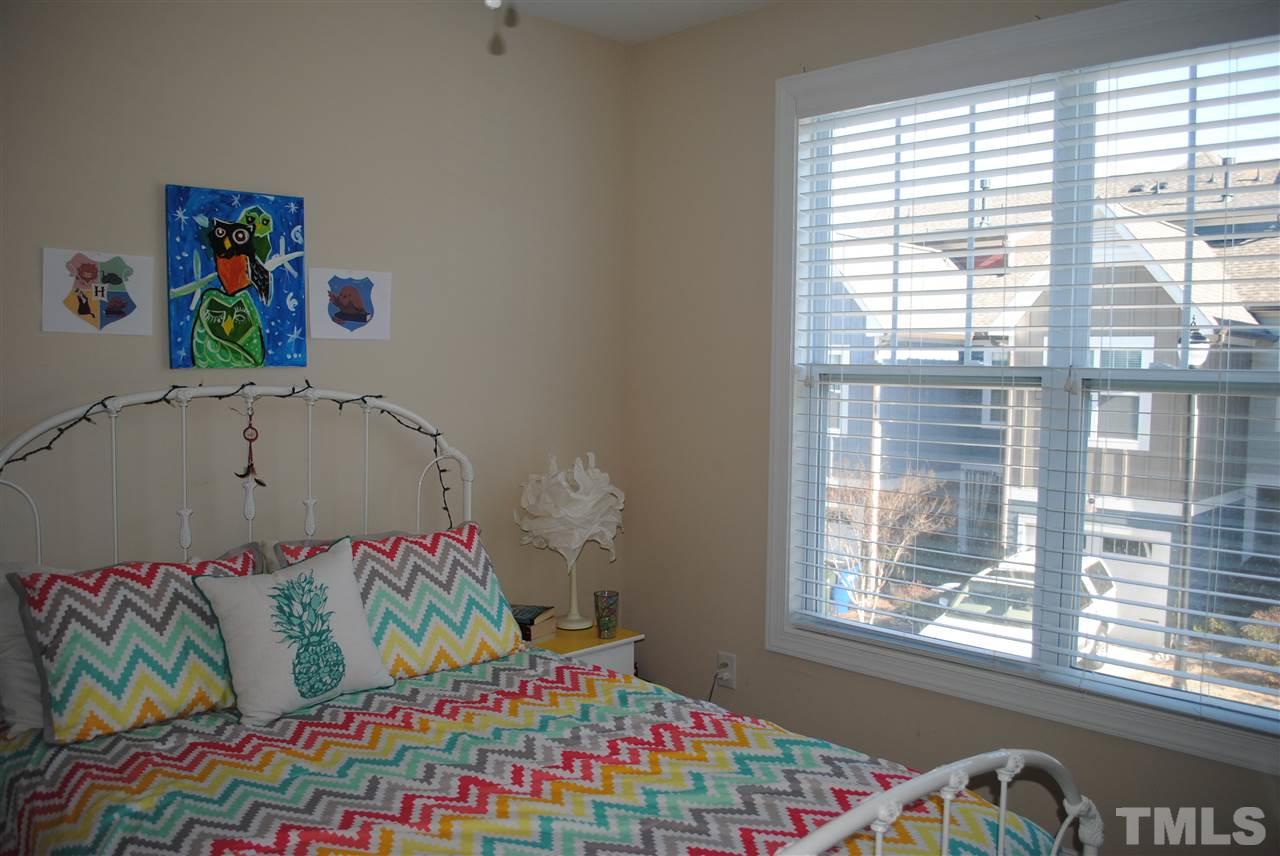 2352 Noble Road Raleigh, NC 27608 - Photo 16 of 24 a bedroom with a bed and a window