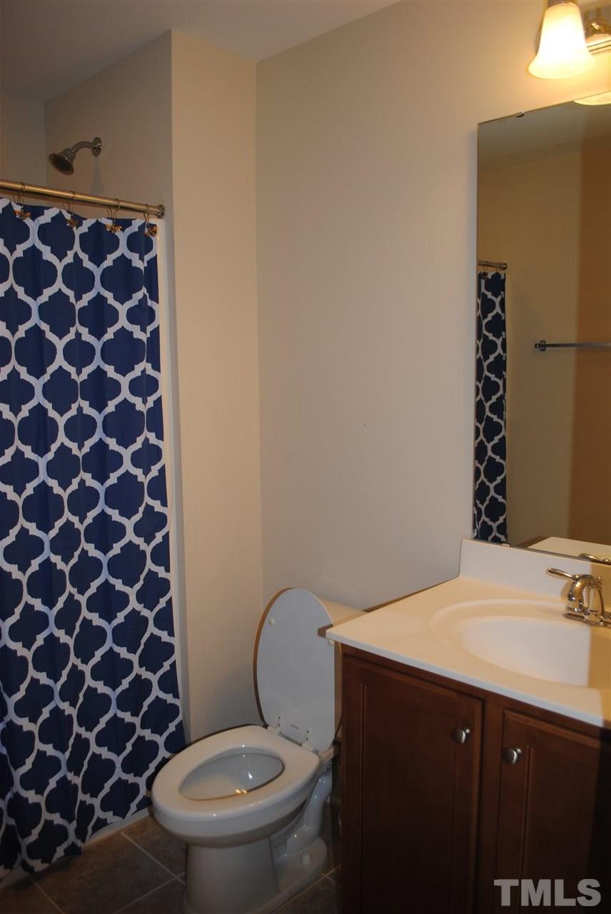 2352 Noble Road Raleigh, NC 27608 - Photo 20 of 24 a bathroom with a sink and a toilet