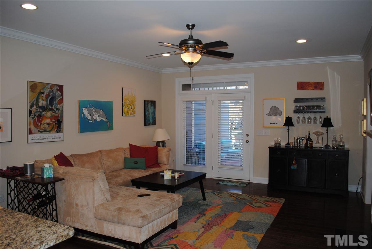 2352 Noble Road Raleigh, NC 27608 - Photo 3 of 24 a living room with furniture and chandelier