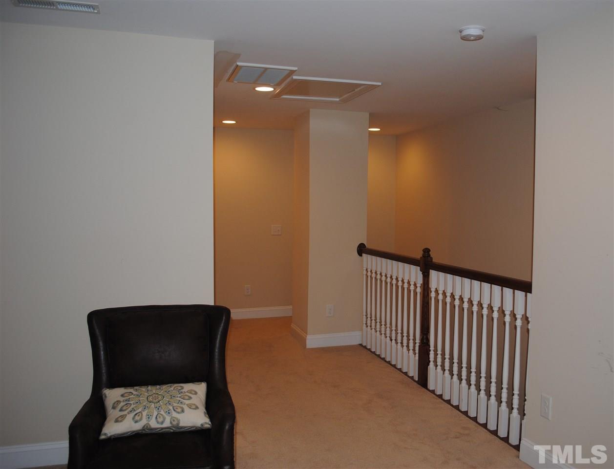 2352 Noble Road Raleigh, NC 27608 - Photo 21 of 24 a view of a hallway with windows