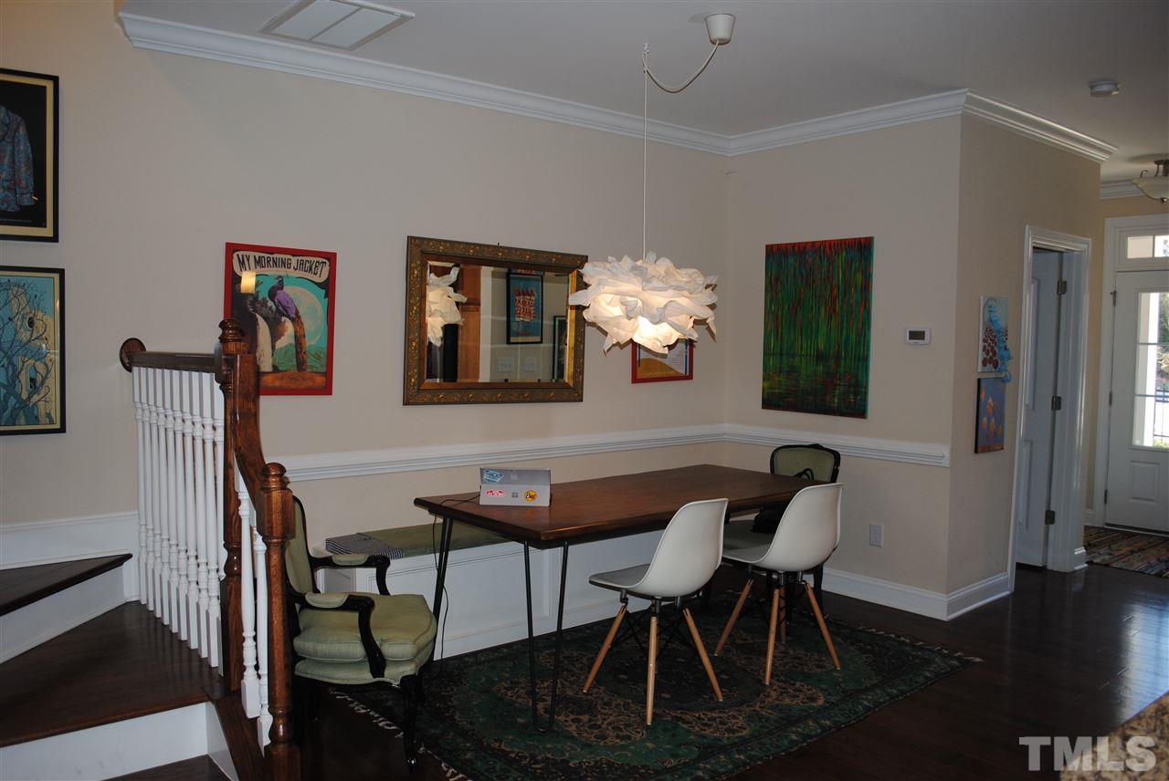 2352 Noble Road Raleigh, NC 27608 - Photo 6 of 24 a view of a dining room with furniture and wooden floor