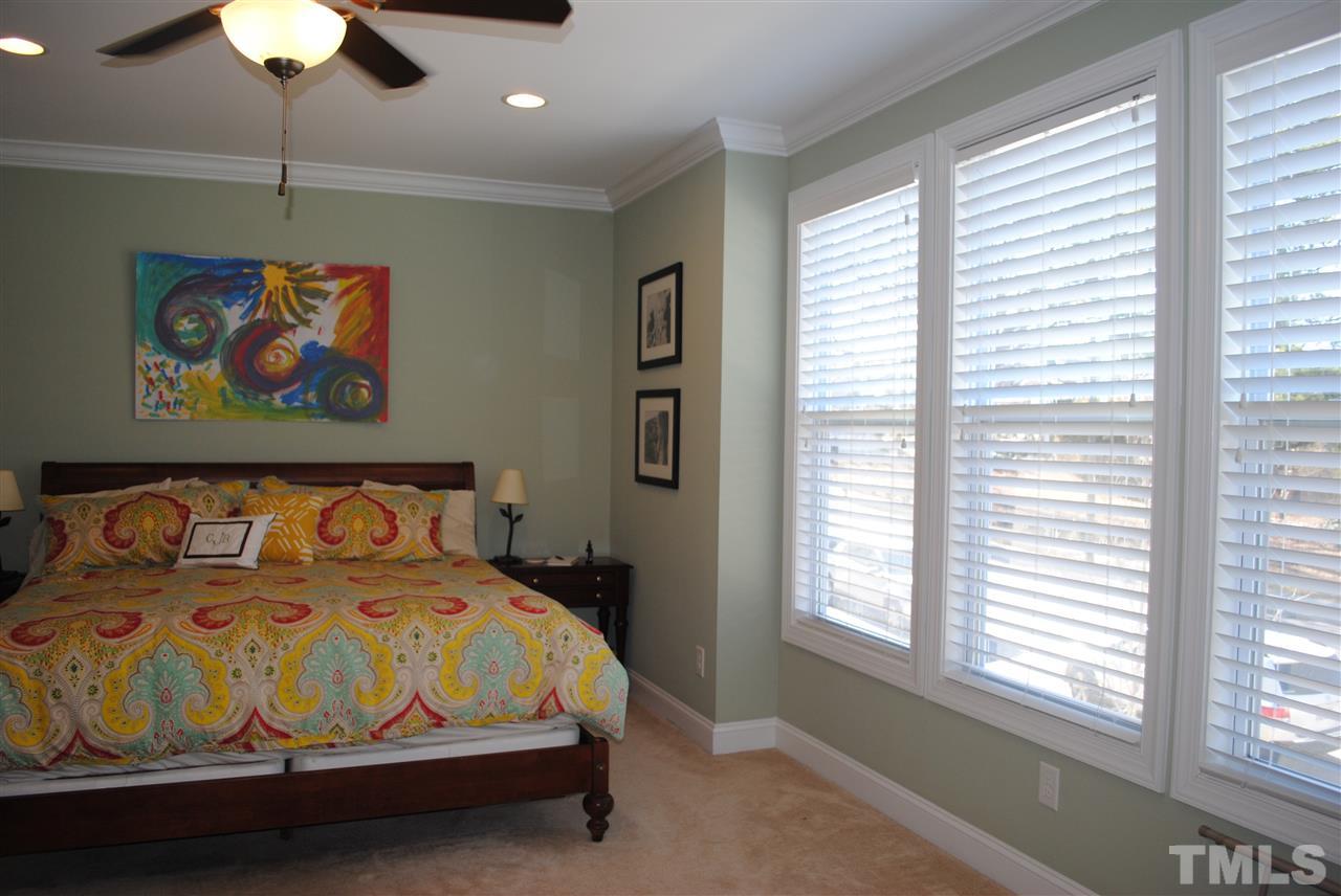 2352 Noble Road Raleigh, NC 27608 - Photo 9 of 24 a bedroom with a bed and a painting on the wall