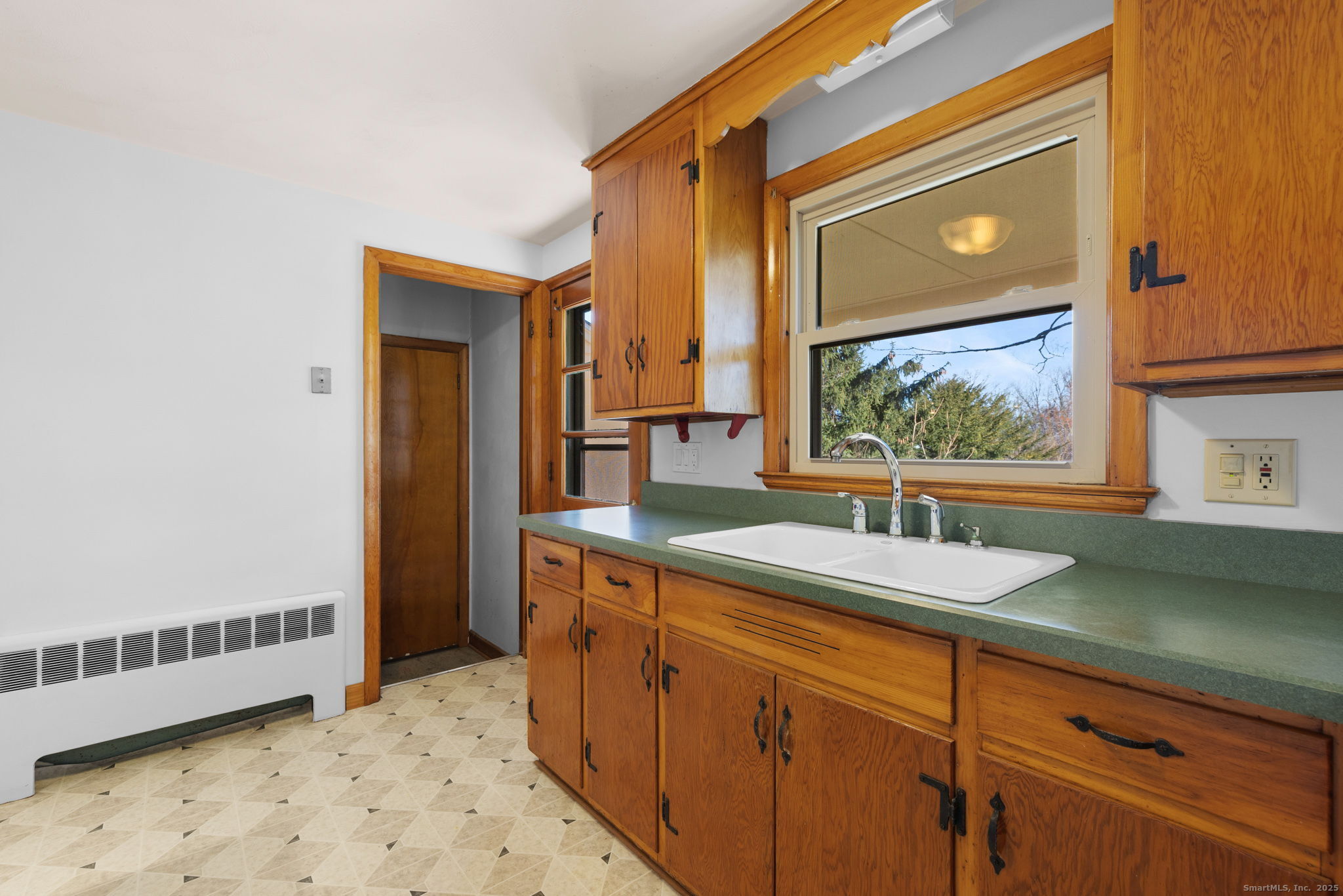 95 Tuttle Street Bristol, CT 06010 - Photo 12 of 28 a bathroom with a sink a vanity and a mirror