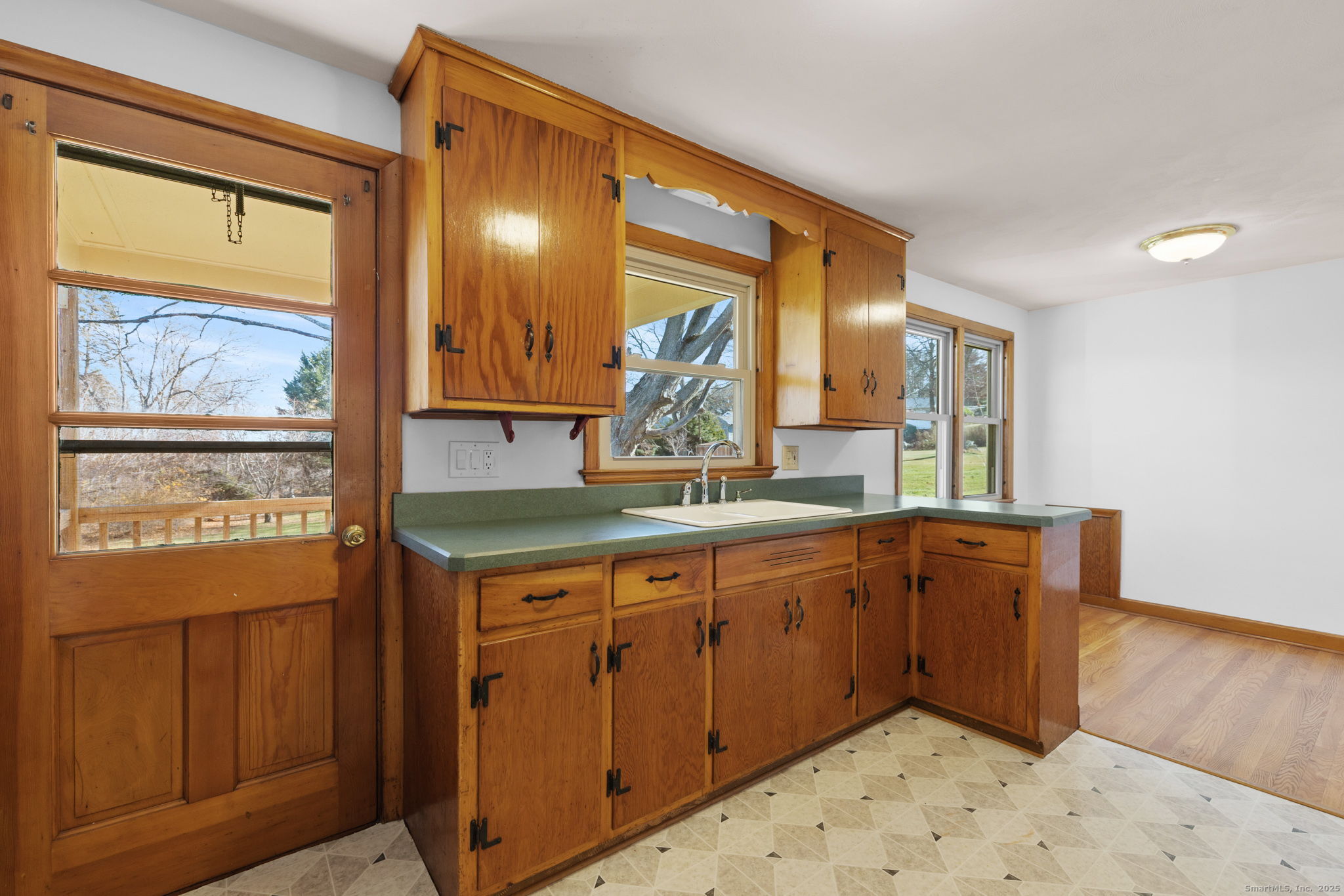 95 Tuttle Street Bristol, CT 06010 - Photo 13 of 28 a kitchen with stainless steel appliances granite countertop wooden cabinets a sink and dishwasher