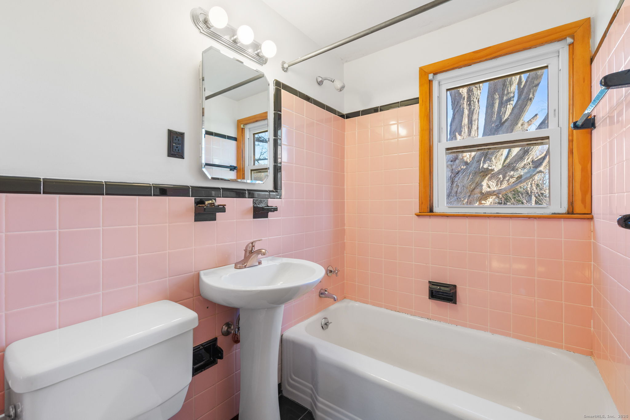 95 Tuttle Street Bristol, CT 06010 - Photo 20 of 28 a bathroom with a sink toilet and shower