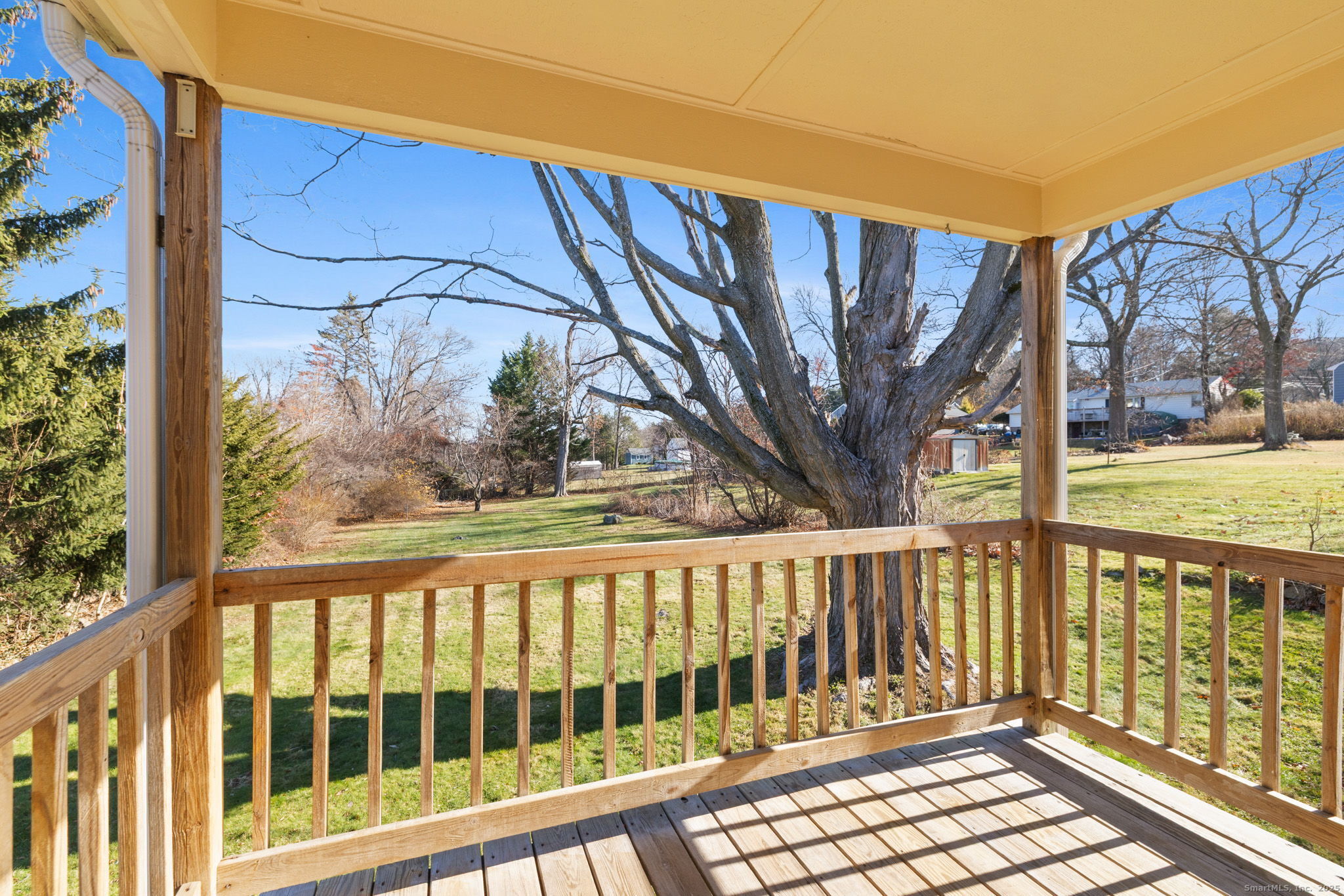 95 Tuttle Street Bristol, CT 06010 - Photo 26 of 28 a view of a street with wooden fence