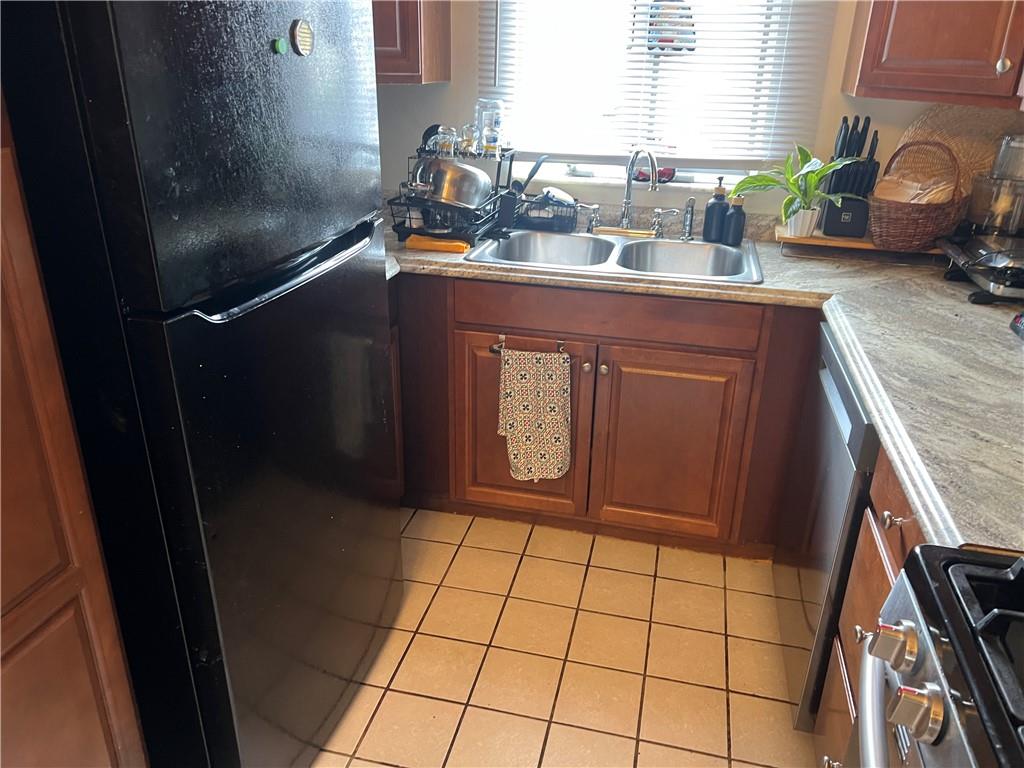 309 Magazine Street Carnegie, PA 15106 - Photo 4 of 18 a room with granite countertop a sink a granite counter top and a potted plant