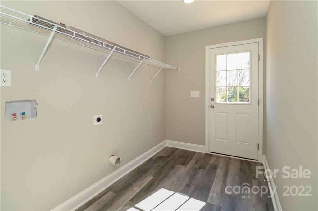287 Sunderland Road Southwest Concord, NC 28027 - Photo 11 of 16 a view of a room with wooden floor and cabinet
