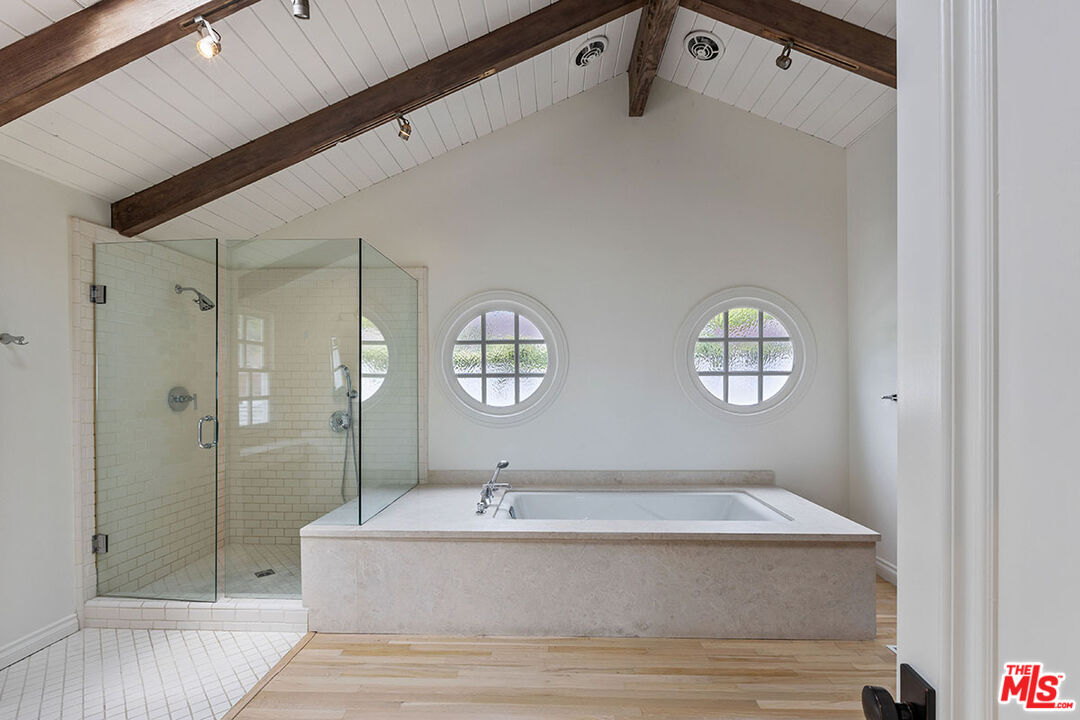 1462 Rising Glen Road Los Angeles, CA 90069 - Photo 26 of 40 a bathroom with a tub sink shower and mirror