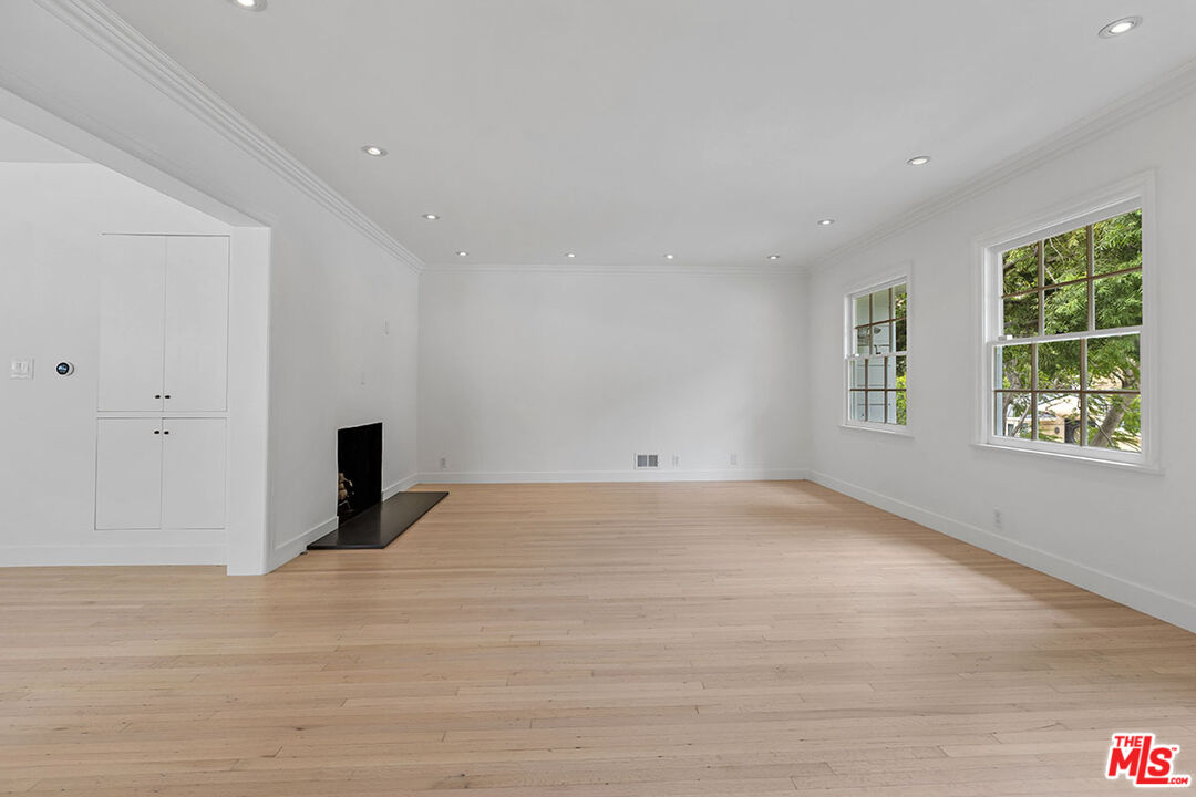 1462 Rising Glen Road Los Angeles, CA 90069 - Photo 5 of 40 a view of an empty room with a window