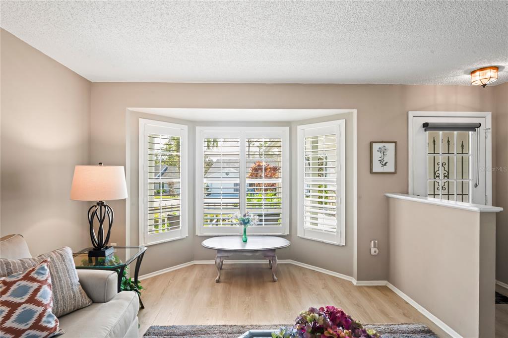 7107 Pond View Court Spring Hill, FL 34606 - Photo 11 of 100 a living room with furniture and a window