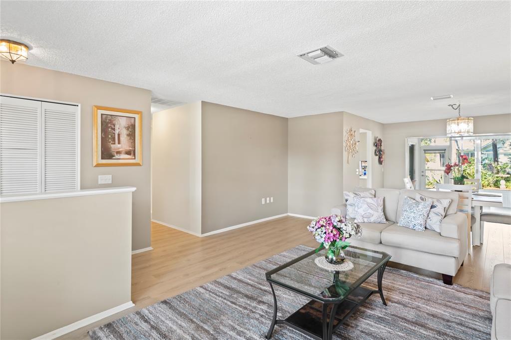 7107 Pond View Court Spring Hill, FL 34606 - Photo 12 of 100 a living room with furniture and a wooden floor