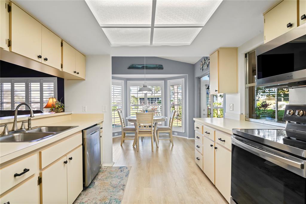 7107 Pond View Court Spring Hill, FL 34606 - Photo 19 of 100 a large kitchen with cabinets