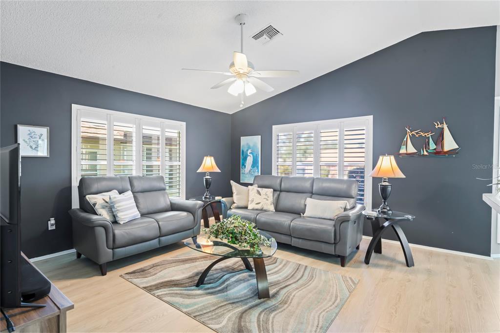 7107 Pond View Court Spring Hill, FL 34606 - Photo 25 of 100 a living room with furniture and a large window