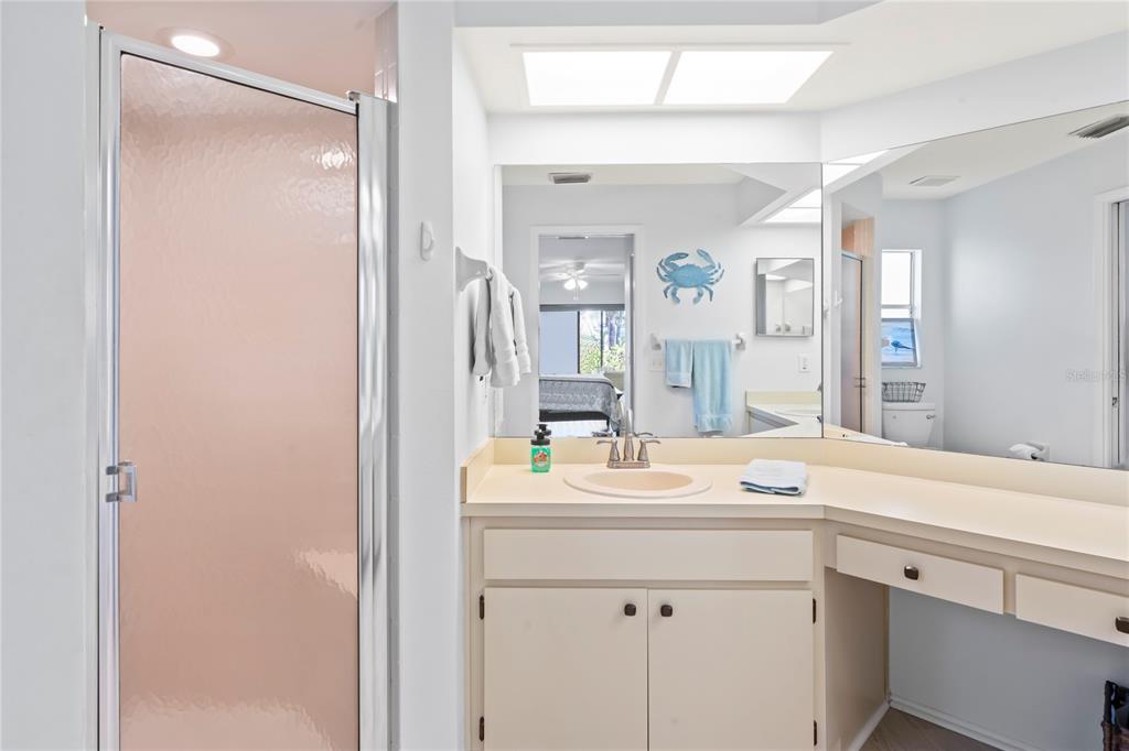 7107 Pond View Court Spring Hill, FL 34606 - Photo 33 of 100 a room with a sink vanity and mirror