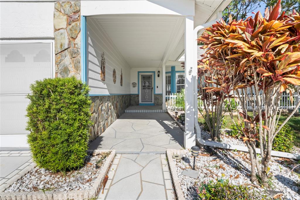 7107 Pond View Court Spring Hill, FL 34606 - Photo 4 of 100 a view of a house with a yard