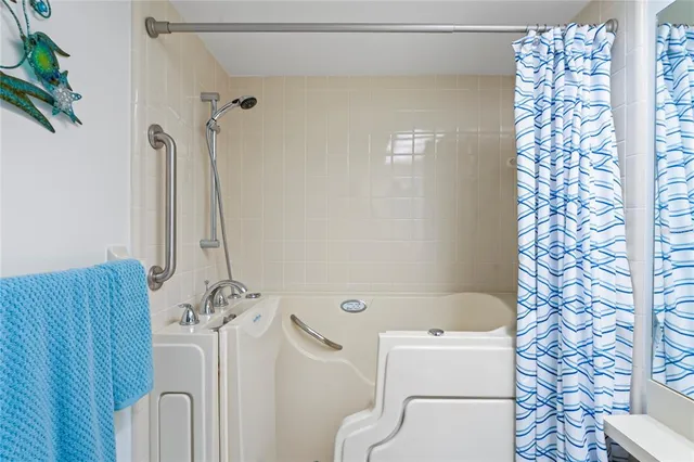 an aerial view of residential houses with outdoor space and street view