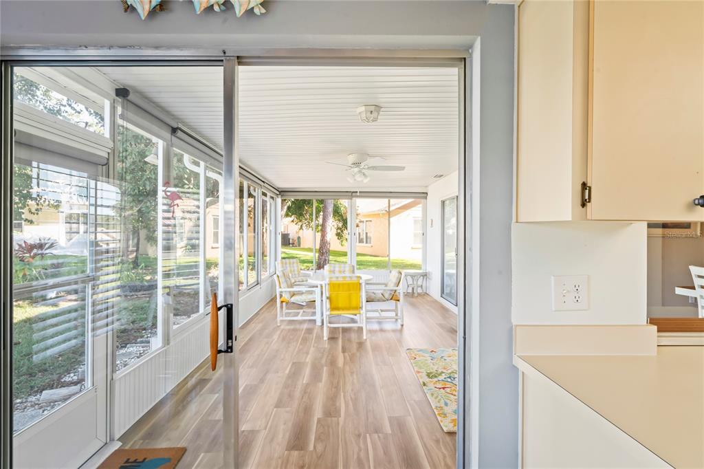 7107 Pond View Court Spring Hill, FL 34606 - Photo 45 of 100 a view of living room with furniture and floor to ceiling window