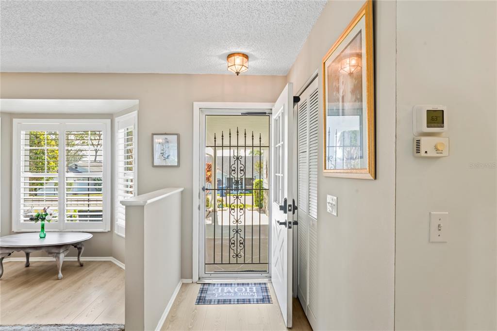 7107 Pond View Court Spring Hill, FL 34606 - Photo 6 of 100 a view of a hallway with windows