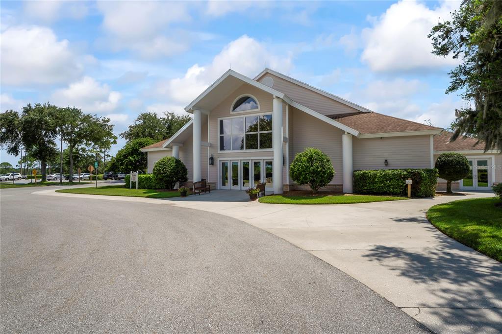 7107 Pond View Court Spring Hill, FL 34606 - Photo 74 of 100 a front view of a house with a yard and garage