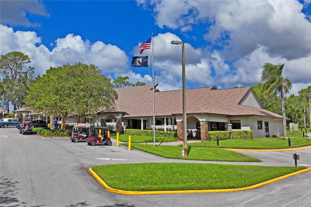 7107 Pond View Court Spring Hill, FL 34606 - Photo 95 of 100 a view of a white house with a big yard and large trees