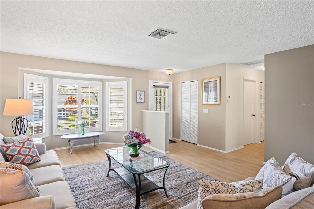 7107 Pond View Court Spring Hill, FL 34606 - Photo 10 of 100 a living room with furniture and a large window