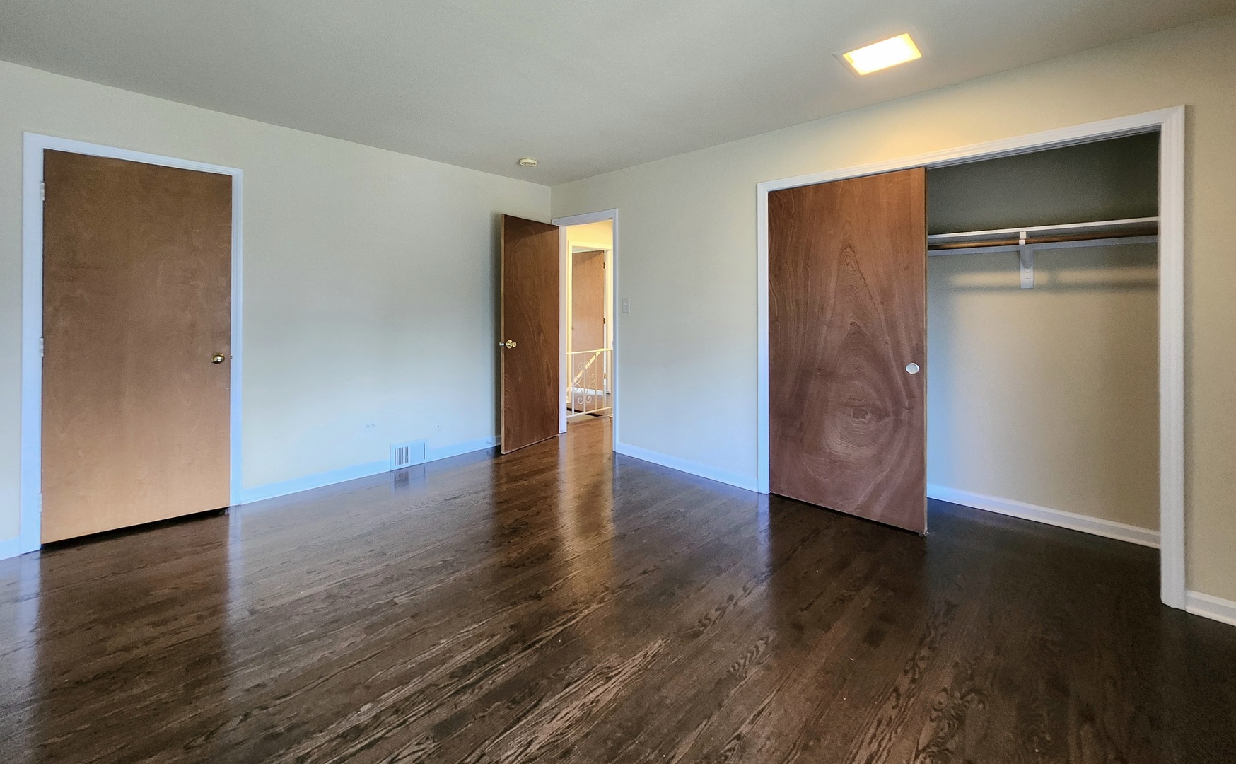 818 Concord Lane, Unit 818 Barrington, IL 60010 - Photo 14 of 16 an empty room with wooden floor & closet area