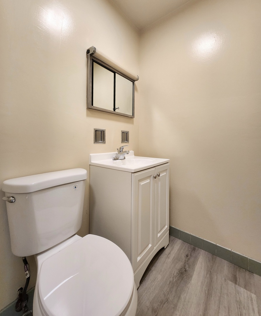818 Concord Lane, Unit 818 Barrington, IL 60010 - Photo 10 of 16 a bathroom with a toilet sink and mirror