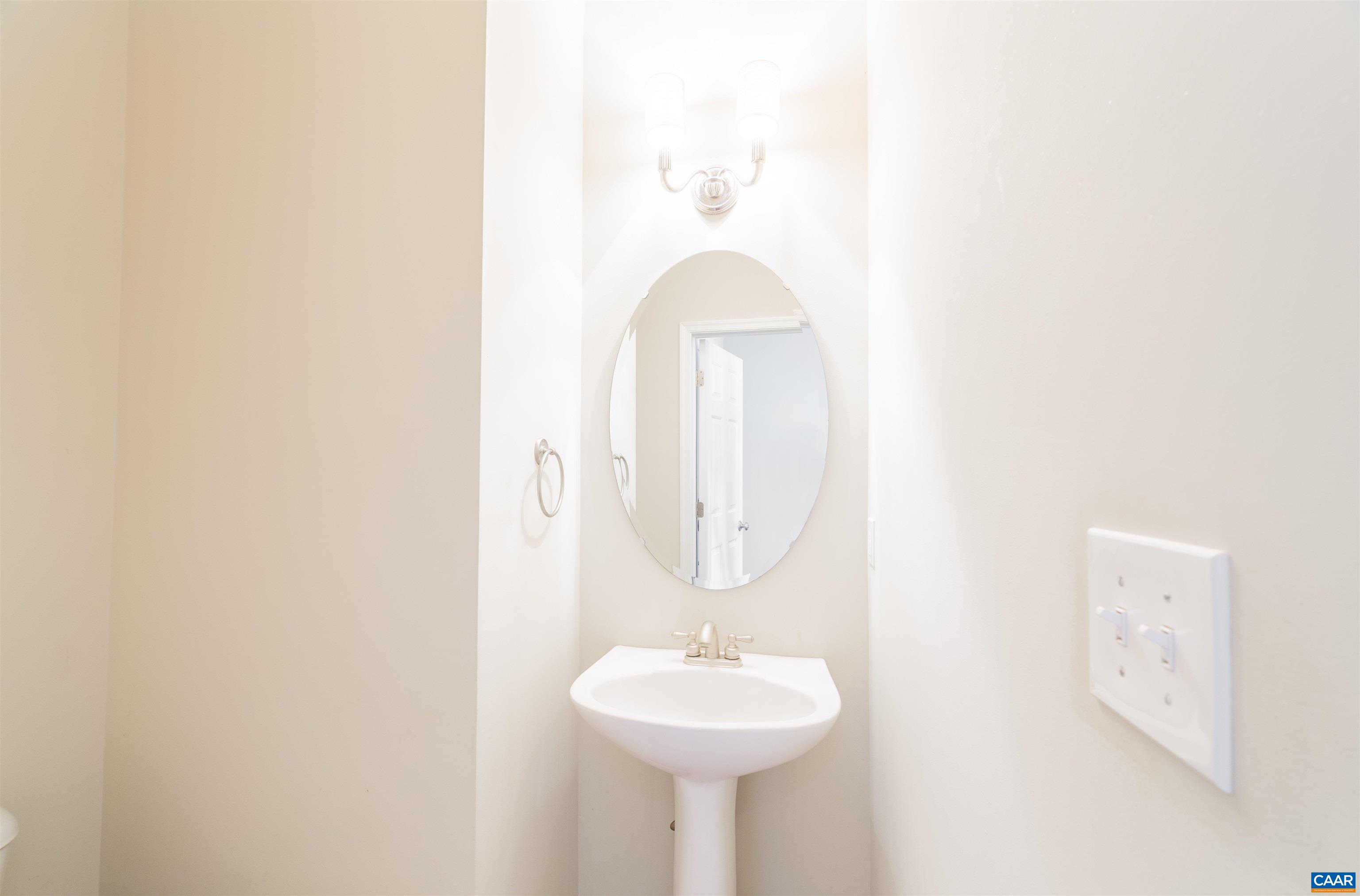 351 Quarry Road Charlottesville, VA 22902 - Photo 10 of 37 a bathroom with a sink and a mirror