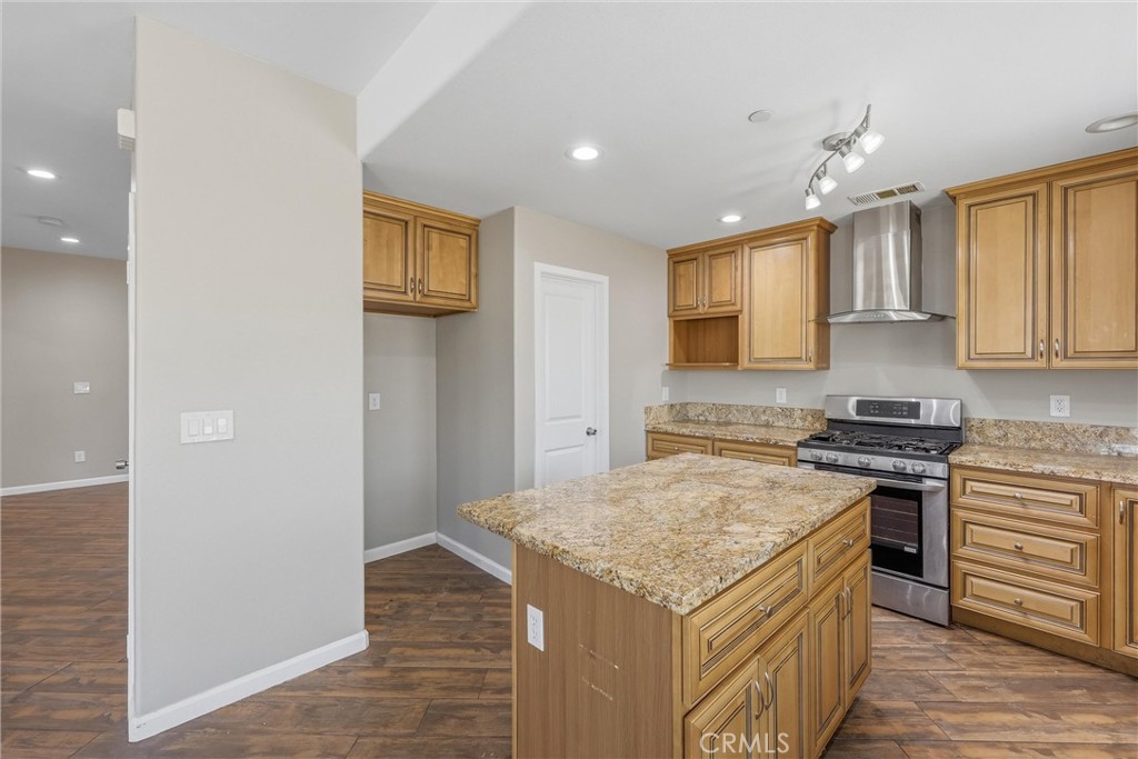 956 West Tibbot Street Rialto, CA 92377 - Photo 15 of 37 a kitchen that has a sink a stove and oven