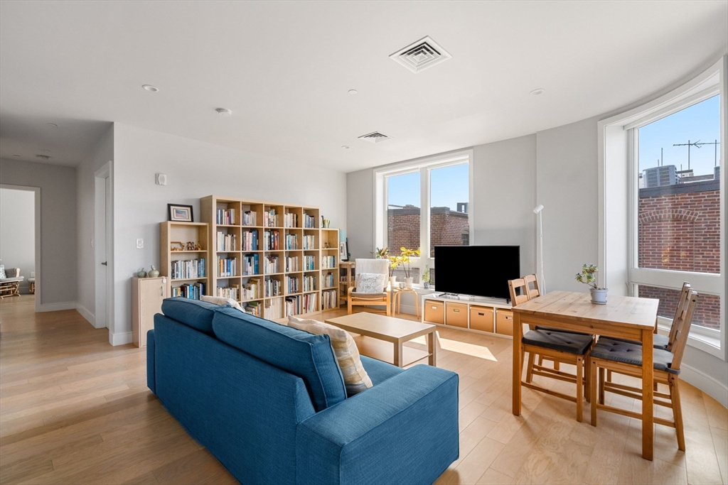 44-50 Symphony Road, Unit 403 Boston, MA 02115 - Photo 2 of 28 a living room with furniture and a flat screen tv