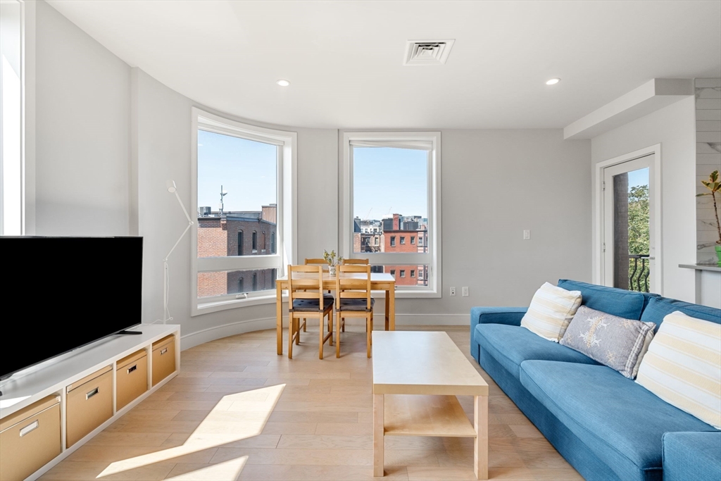 44-50 Symphony Road, Unit 403 Boston, MA 02115 - Photo 5 of 28 a living room with furniture and a flat screen tv