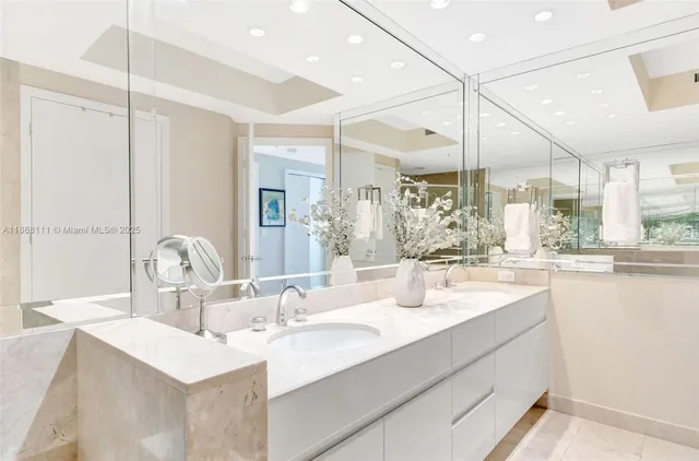 a bathroom with a sink mirror and view