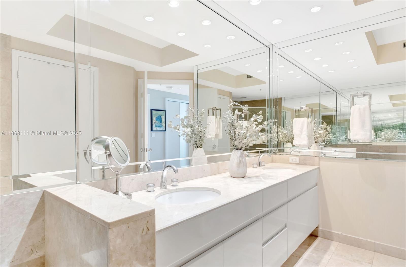 848 Brickell Key Drive, Unit 2605 Miami, FL 33131 - Photo 18 of 35 a bathroom with a sink mirror and view