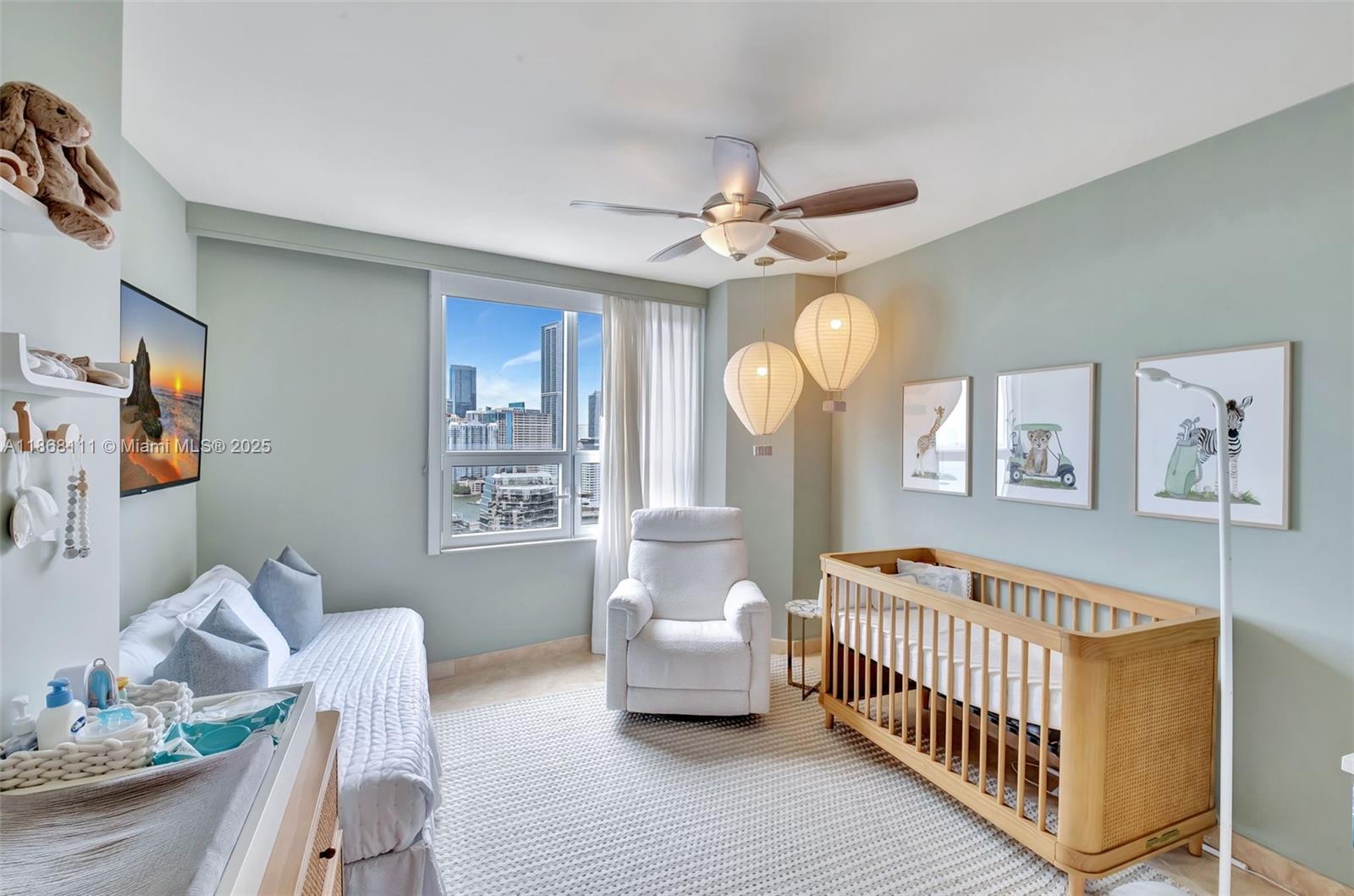 848 Brickell Key Drive, Unit 2605 Miami, FL 33131 - Photo 20 of 35 a bedroom with furniture and a window