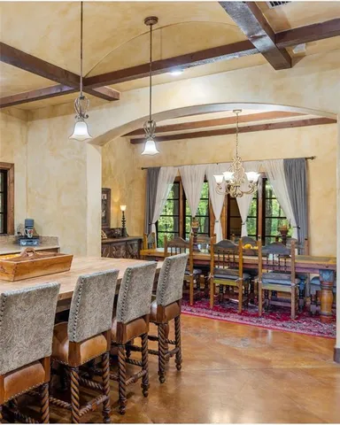 a kitchen with a sink and a stove top oven