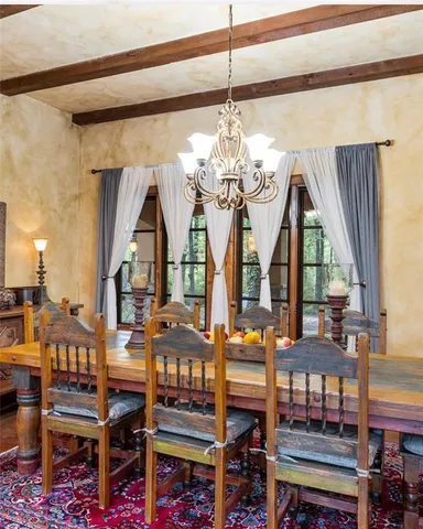 a view of a living room and kitchen with a sink