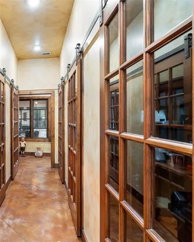 a view of a storage & utility room with a washer dryer and washer