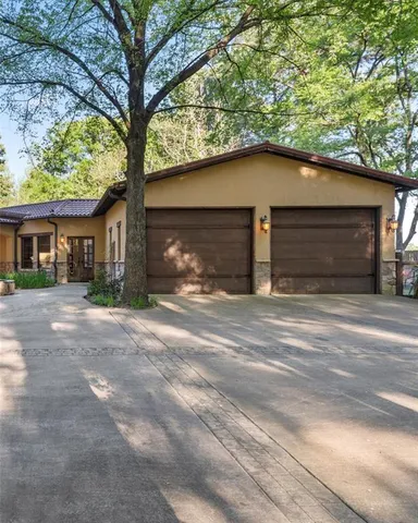 a view of a house with a yard and garage
