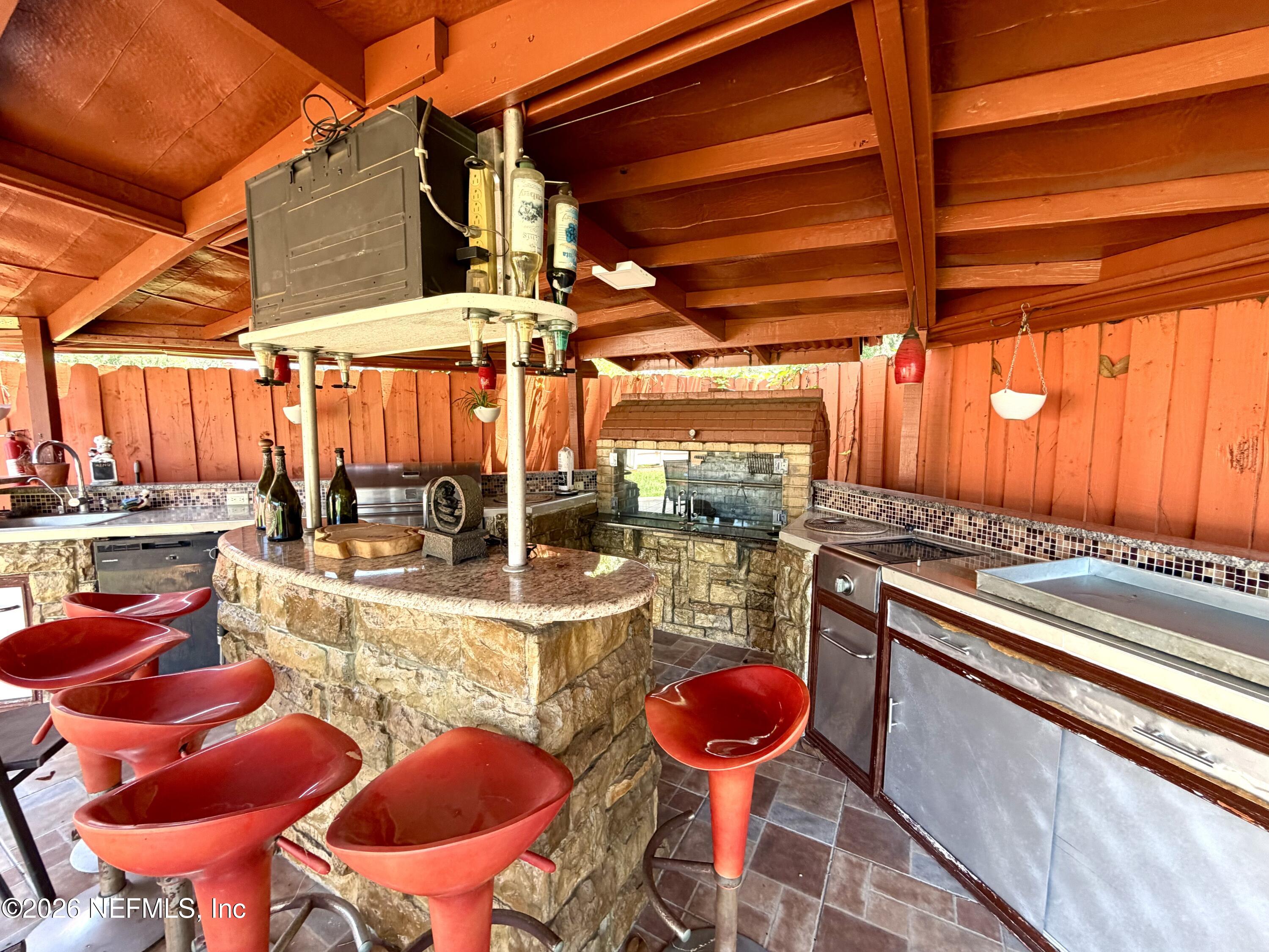 4127 Springwood Road Jacksonville, FL 32207 - Photo 43 of 63 a view of a room with table and chairs