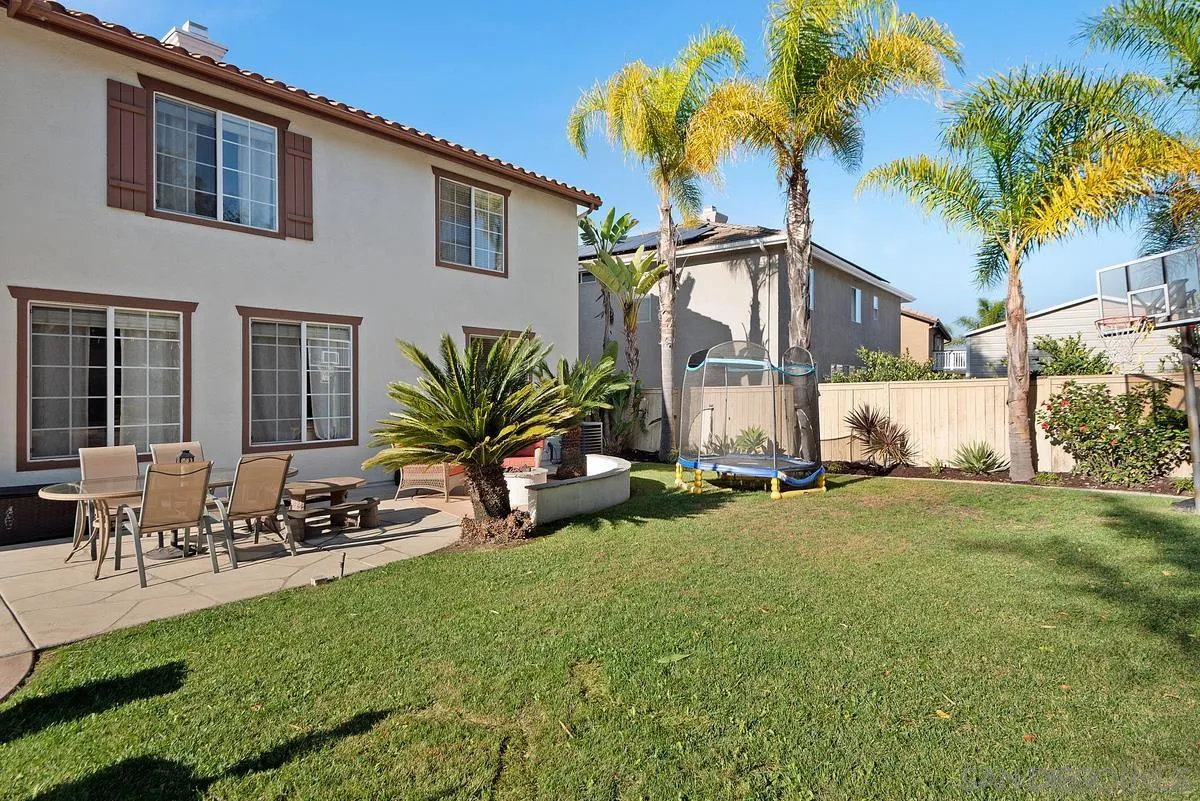 717 Via Cafetal San Marcos, CA 92069 - Photo 11 of 41 a front view of a house with garden and sitting area
