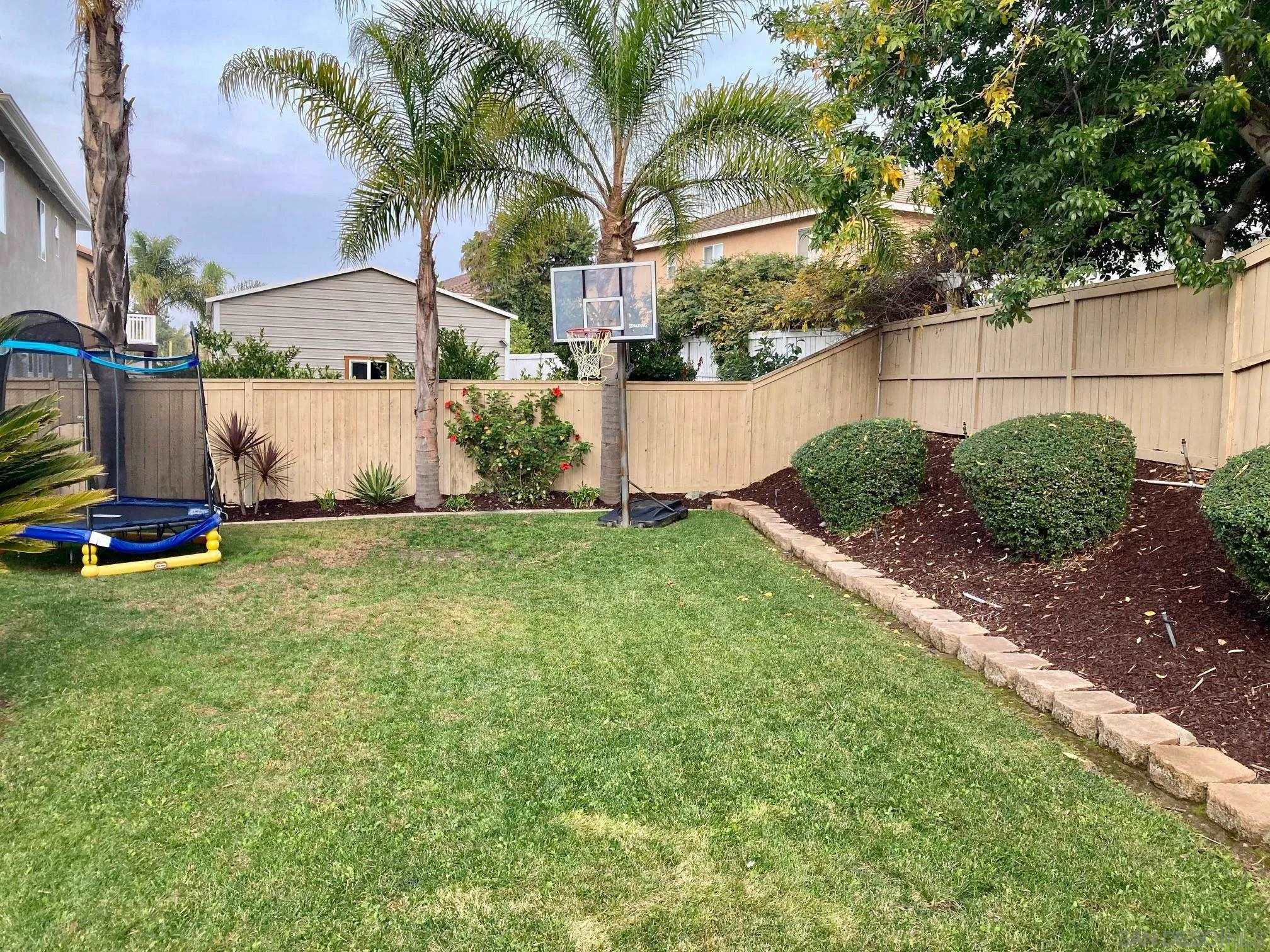 717 Via Cafetal San Marcos, CA 92069 - Photo 12 of 41 a view of backyard with green space
